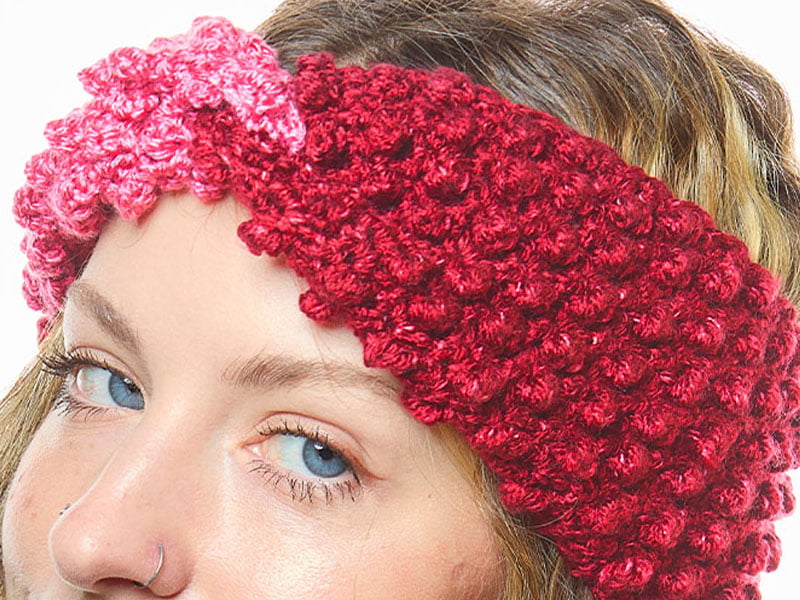 Cranberry crochet headband with a twisted finish and a deeply raised texture