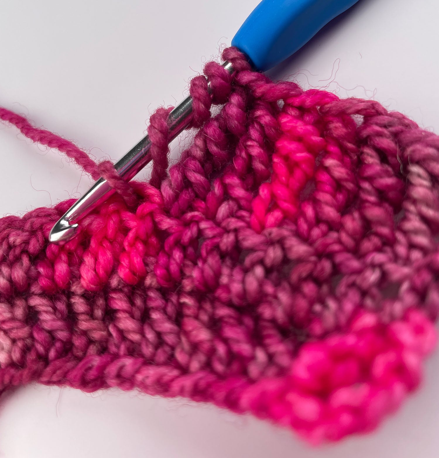 The first pull-through of a double treble crochet, with the new loop on the hook.