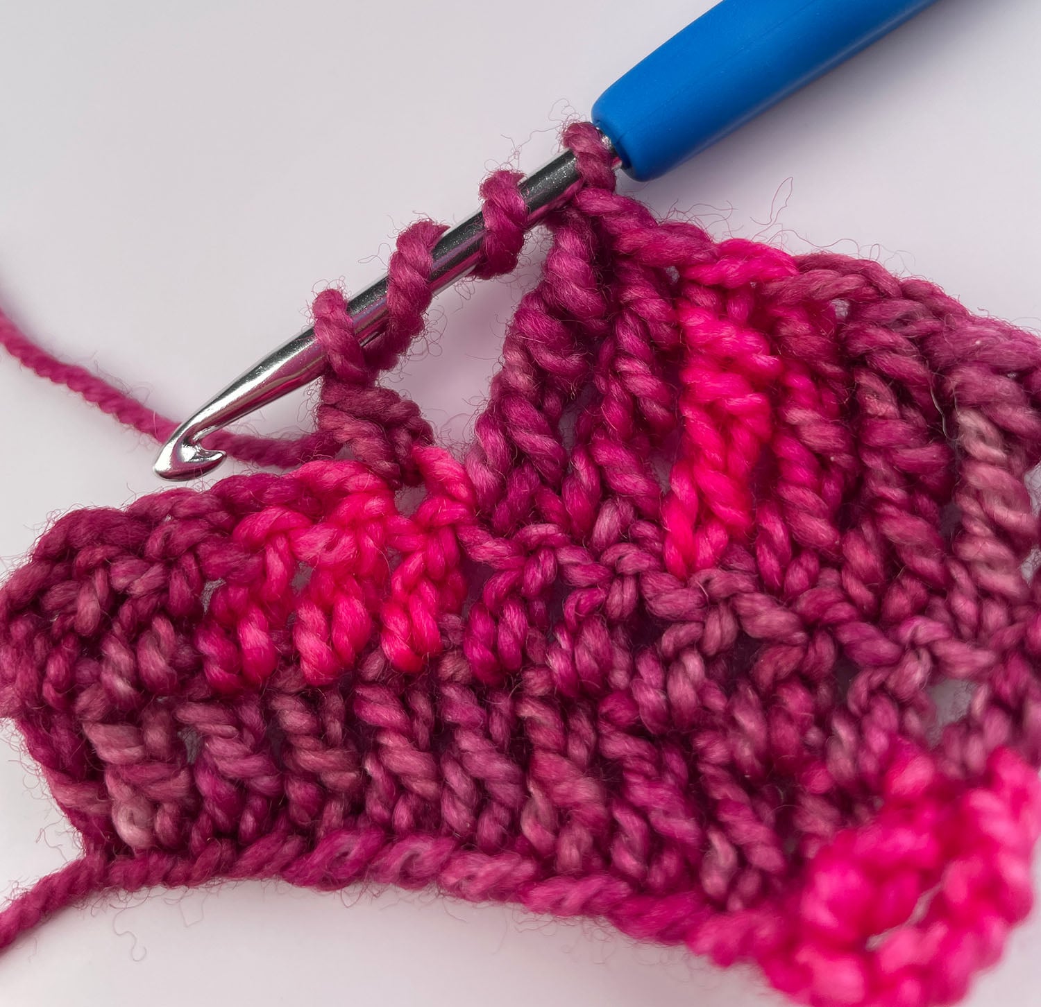 The second pull-through of a double treble crochet.